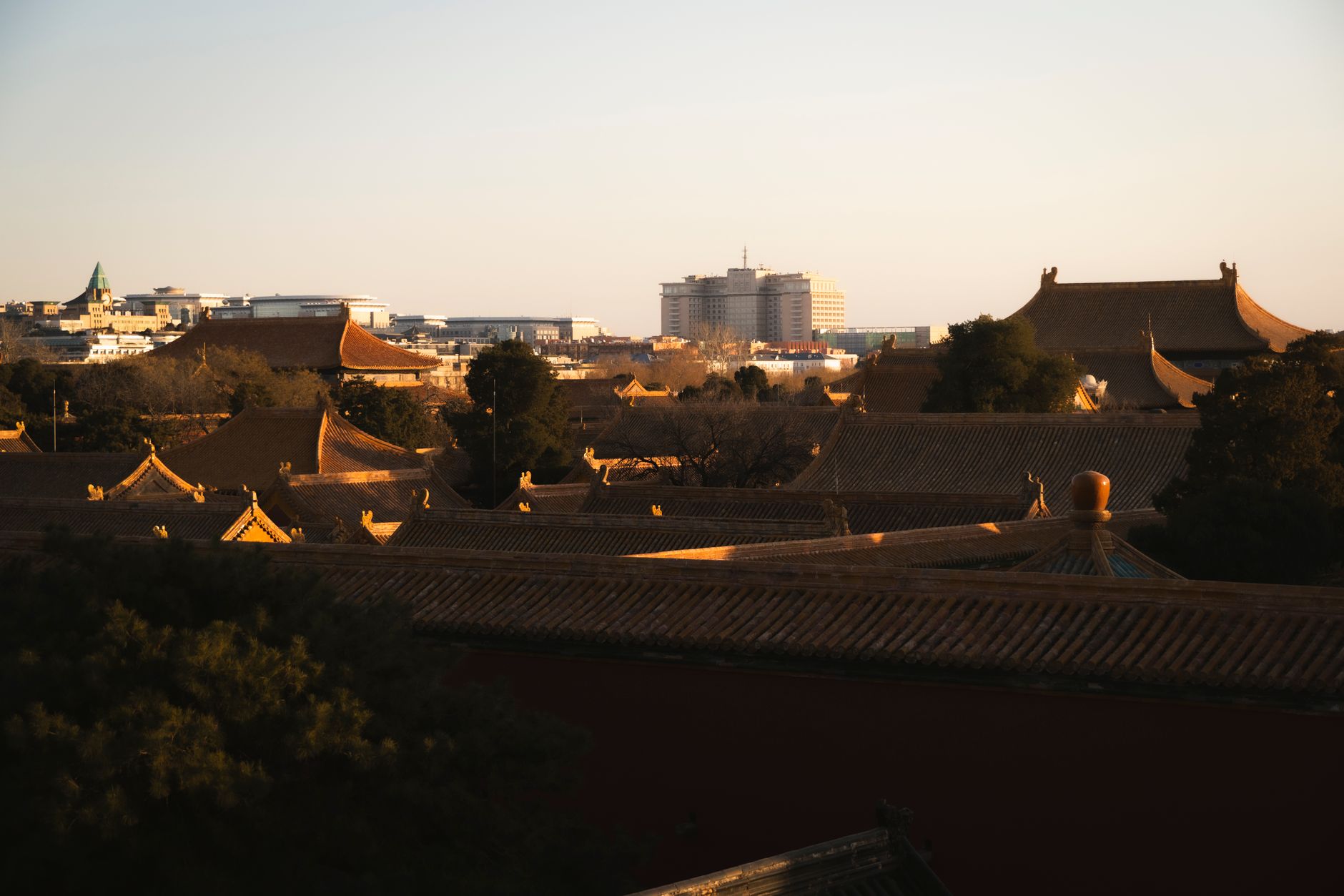 Forbidden City ornate rooftops at sunset