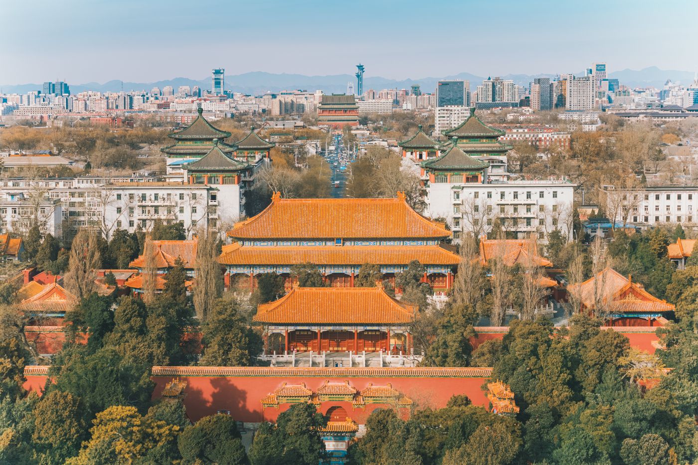 Aerial view of Beijing showing ancient imperial architecture alongside the modern city
