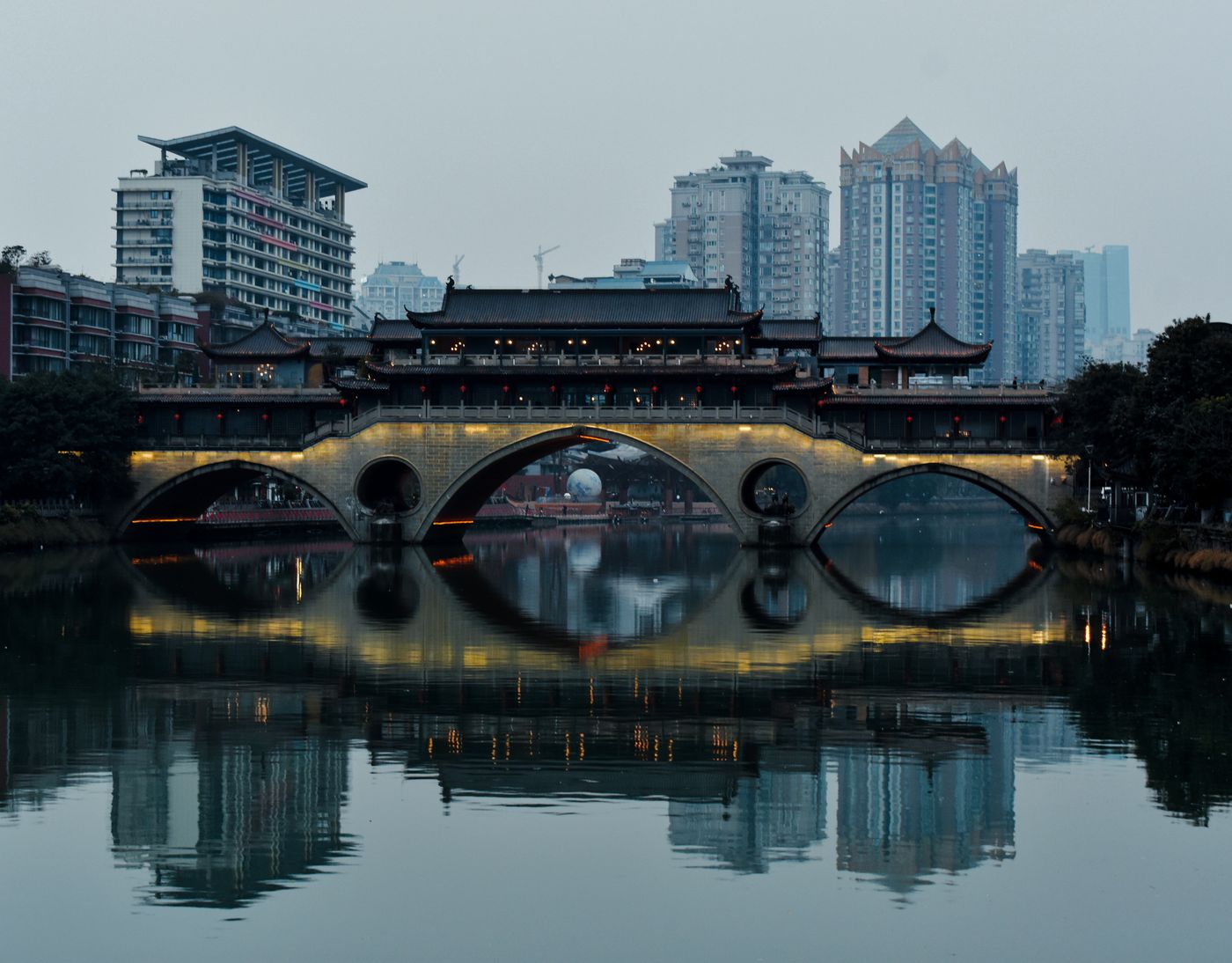 Traditional bridge and modern Chengdu skyline