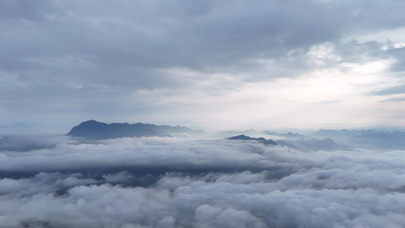 Mountain peaks through clouds in the Guizhou highlands