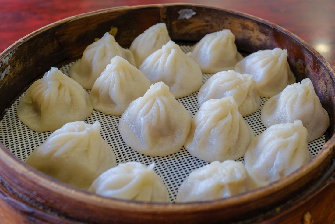 Xiaolongbao soup dumplings in bamboo steamer